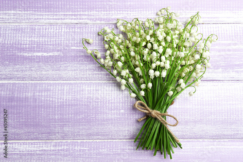 Fototapeta Naklejka Na Ścianę i Meble -  Beautiful lilies of the valley on wooden background