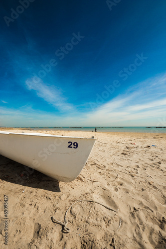 white boat on the beach