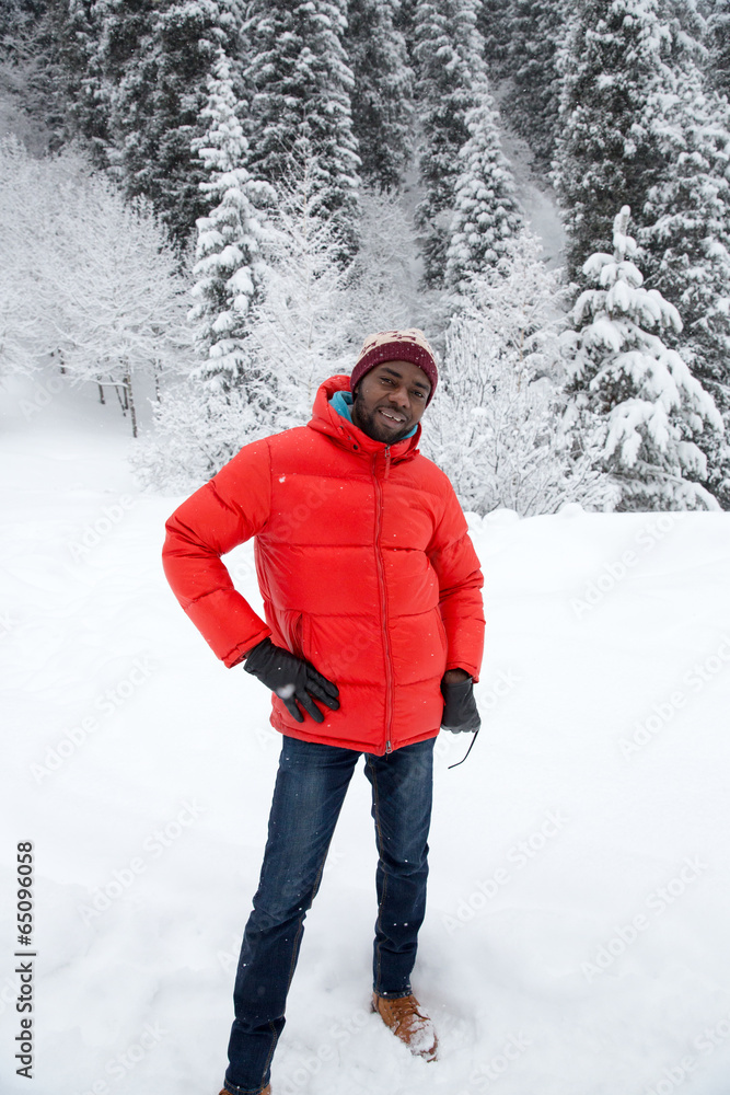 African American Cheerful black man in ski suit