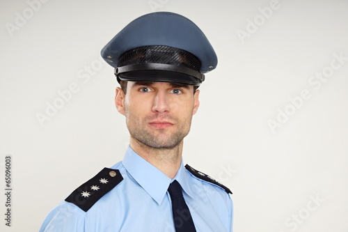Portrait of handsome policeman, left you can write some text © petrdlouhy