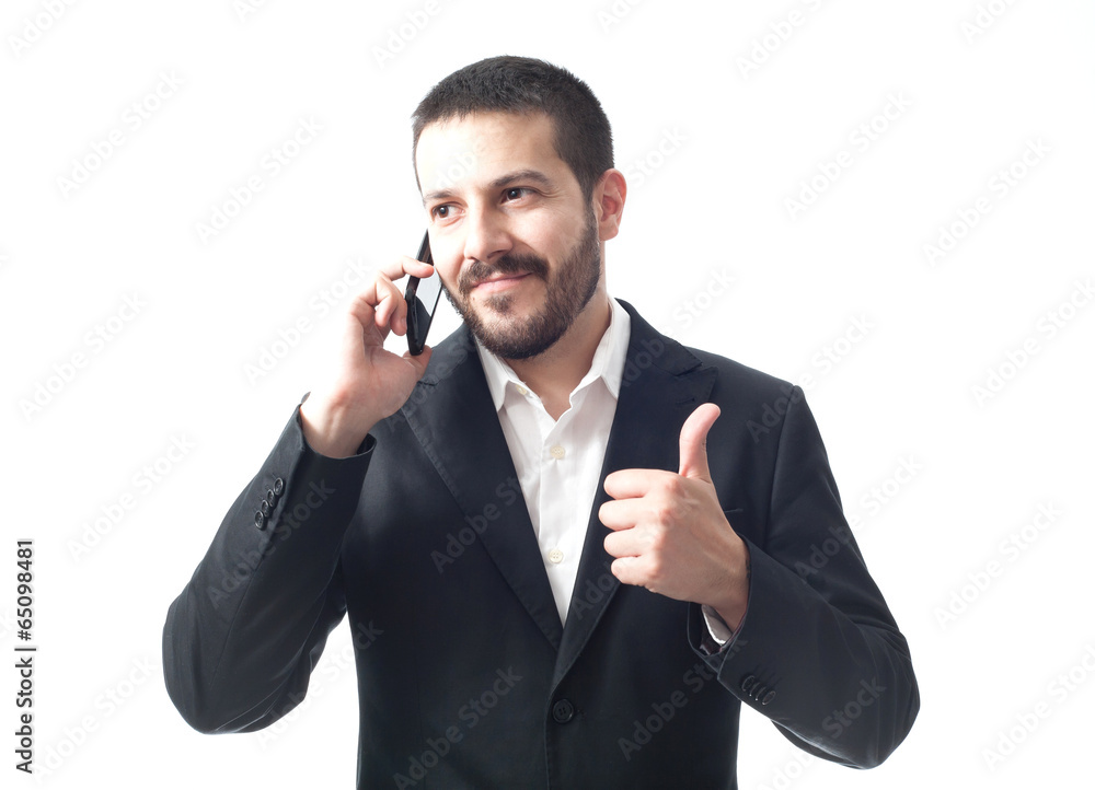 Smiling young businessman on the phone with thumbs up. Smiling young businessman on the phone with thumbs up.