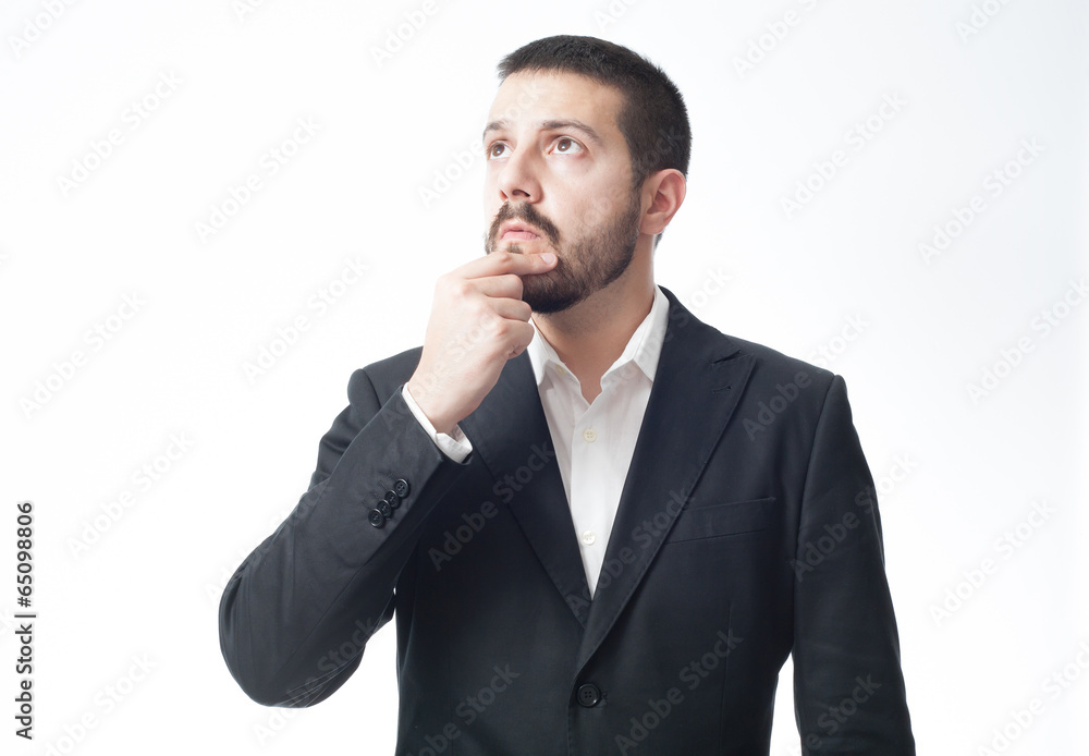 Thinking young businessman with copy space. Thinking young businessman with copy space.