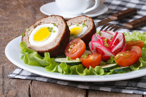 Scotch eggs with salad of fresh vegetables
