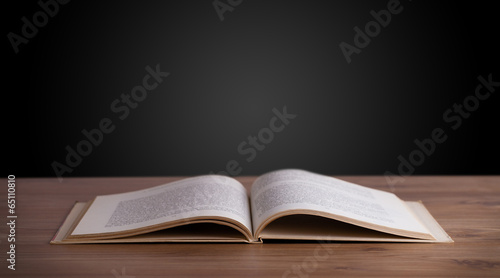 Open book on wooden deck