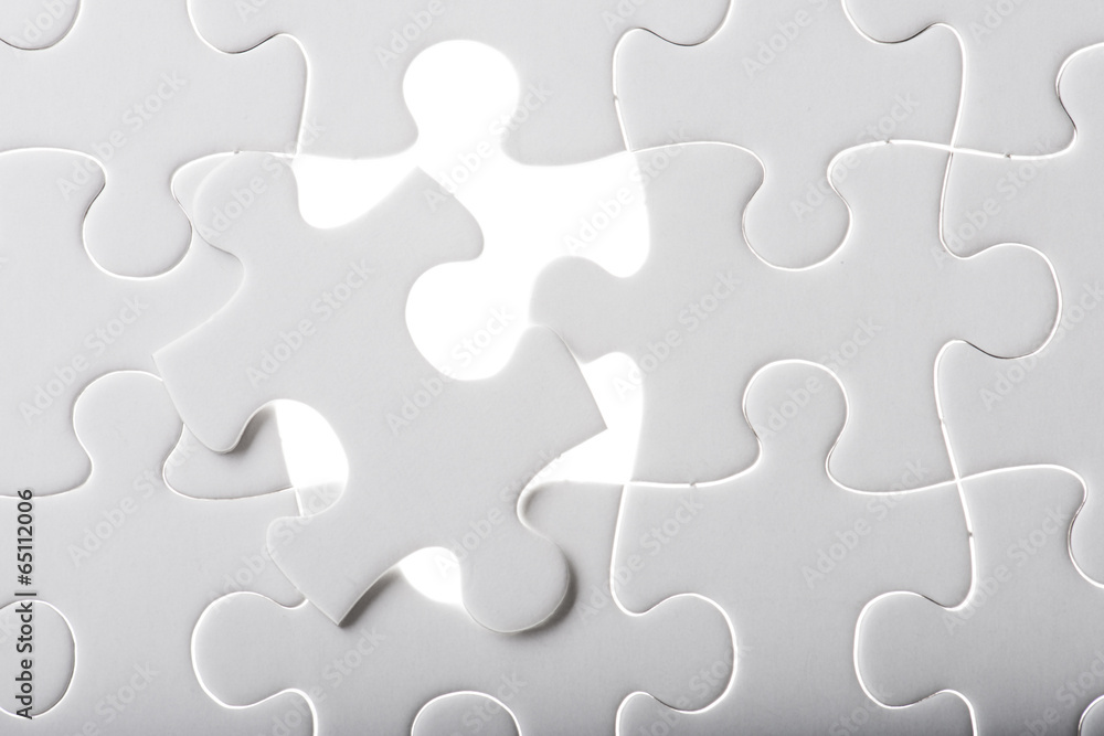 Missing jigsaw puzzle piece with light glow Missing jigsaw puzzle piece with light glow