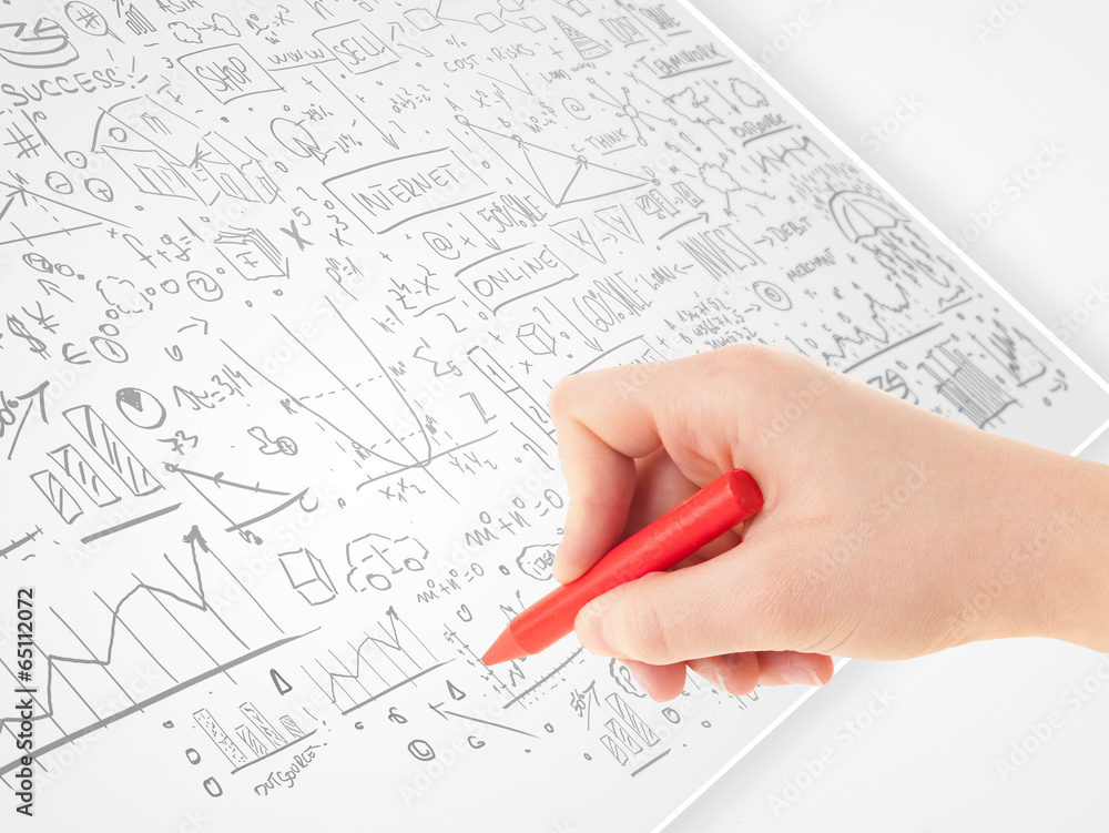 Human hand sketching ideas on a white paper Human hand sketching ideas on a white paper