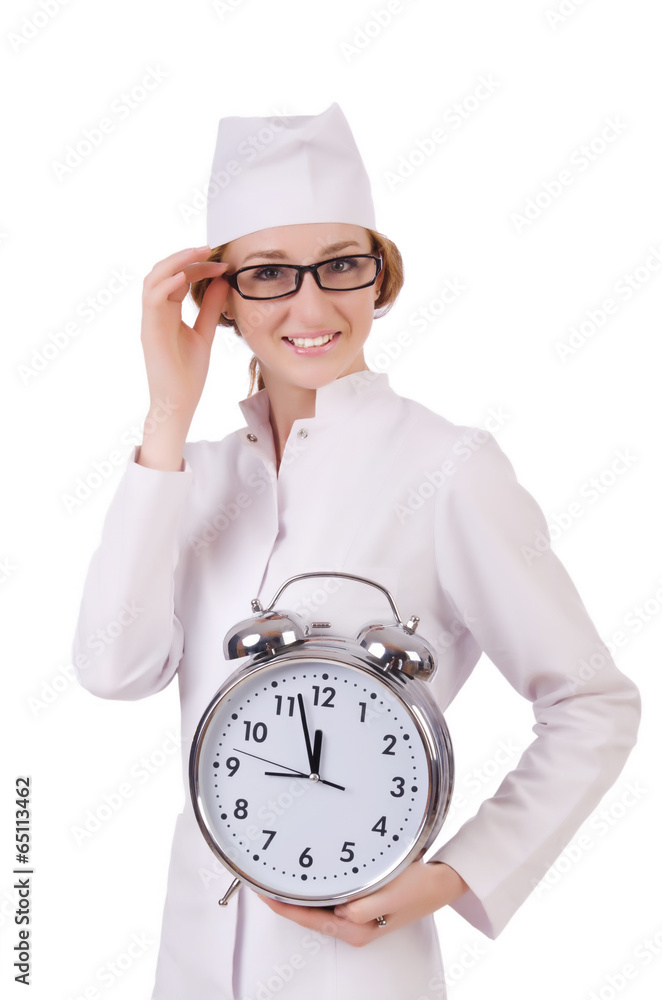 Attractive woman doctor with big clock isolated on white Attractive woman doctor with big clock isolated on white