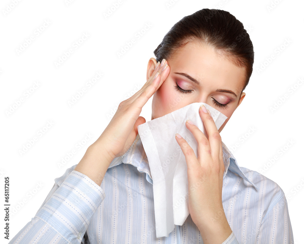 Sick woman blowing her nose, white background Sick woman blowing her nose, white background