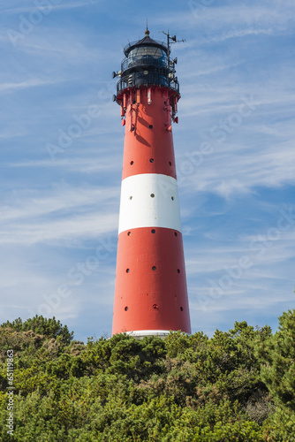 Lighthouse red white on dune vertical.