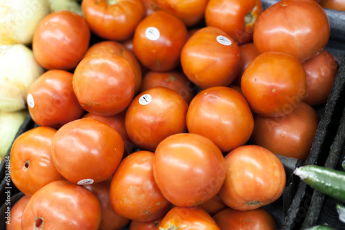 Tomatoes for sale at a market stall