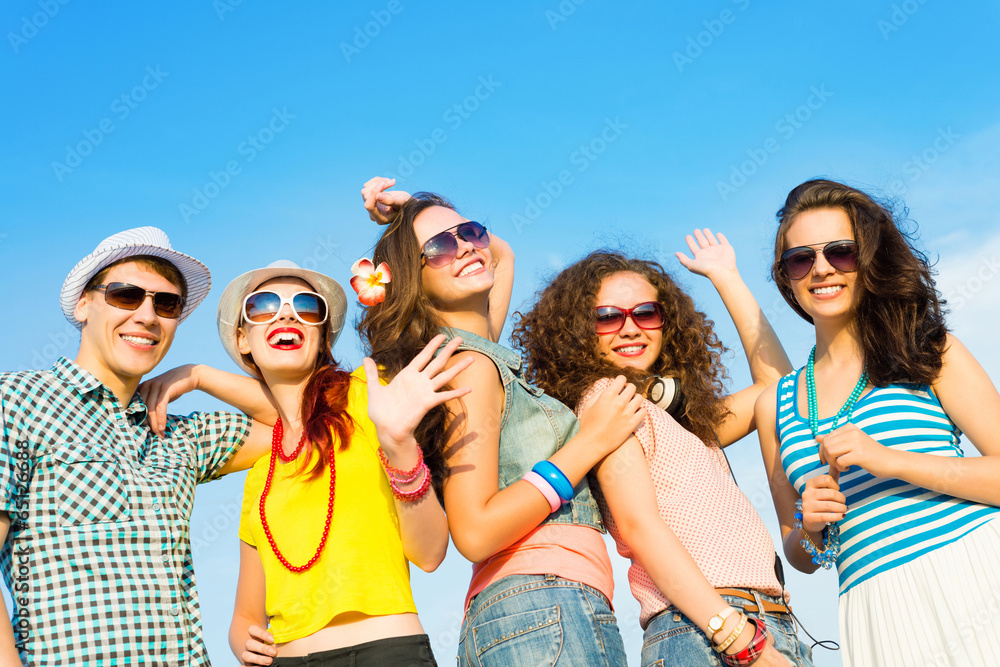 group of young people wearing sunglasses and hat group of young people wearing sunglasses and hat