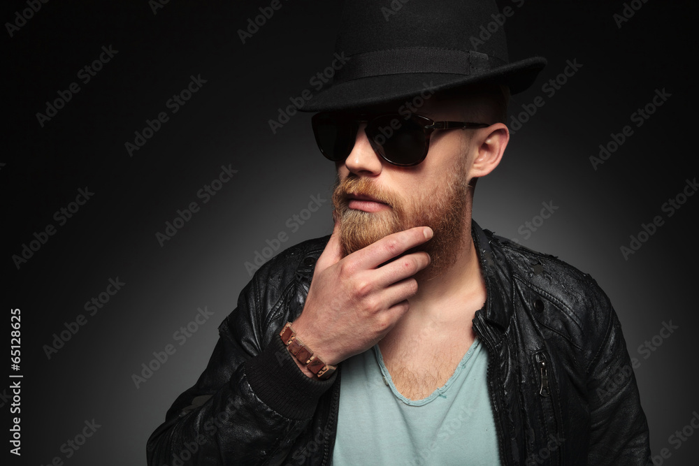 thoughtful young man with long beard thoughtful young man with long beard