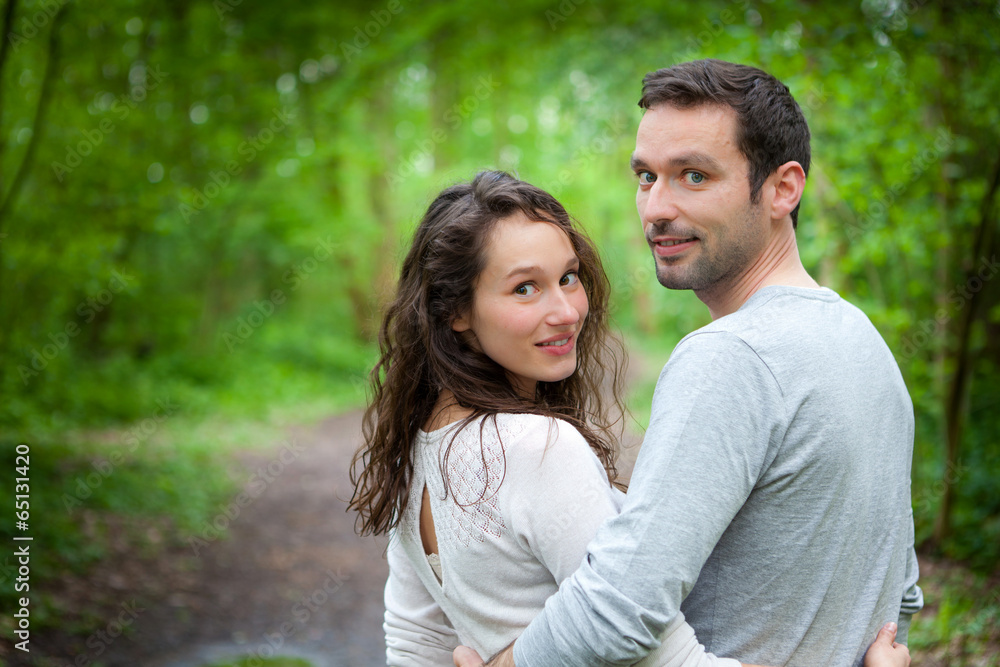Portrait of a young happy couple in the nature Portrait of a young happy couple in the nature
