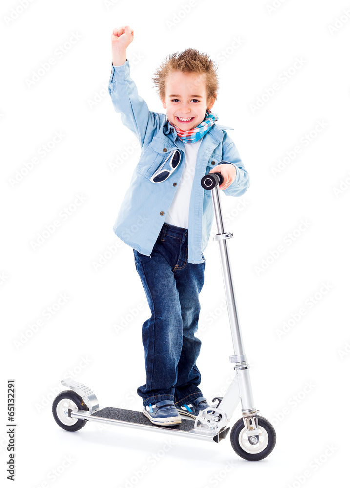 Cheerful boy with raised hand on scooter white background Cheerful boy with raised hand on scooter white background