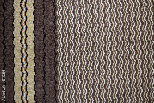 Carpet with brown  decoration close-up background texture