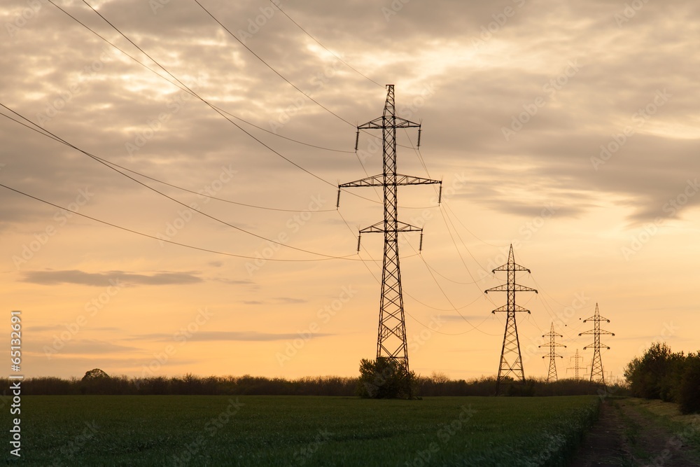Landscape of silhouette of electricity pylons at sunset