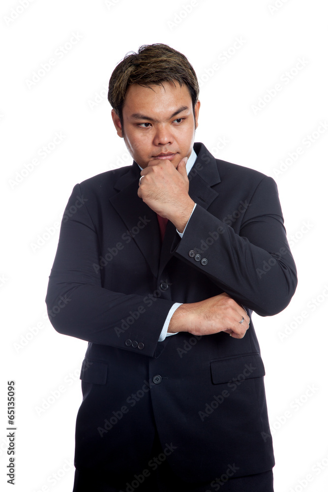 Asian businessman is thinking with hand under the chin Asian businessman is thinking with hand under the chin