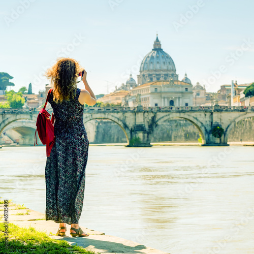 Photography Young woman photographs St Peter's basilica, Rome, Italy