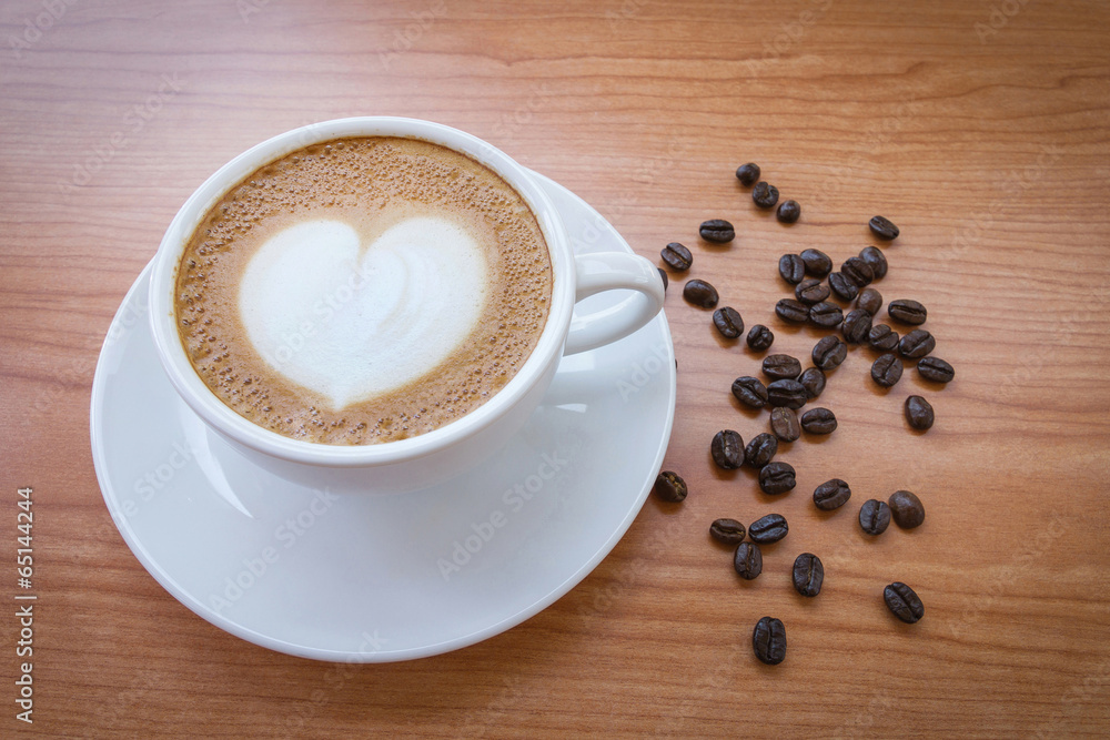 Hot coffee with heart pattern in white cup Hot coffee with heart pattern in white cup