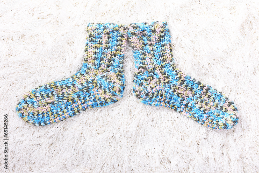Woolen socks, on color background Woolen socks, on color background