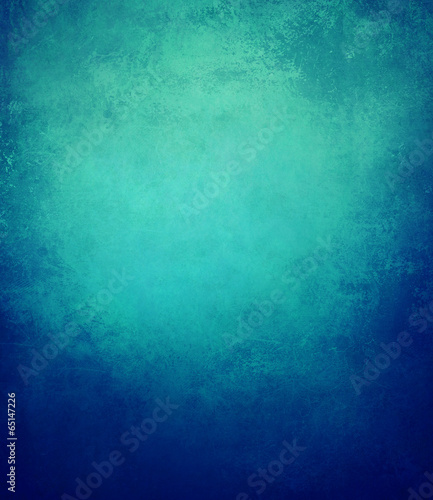 abstract blue background or dark paper with bright center spotli