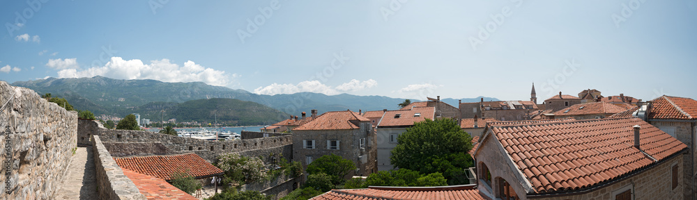 Budva bay behind the tile roofs of old town, Montenegro.