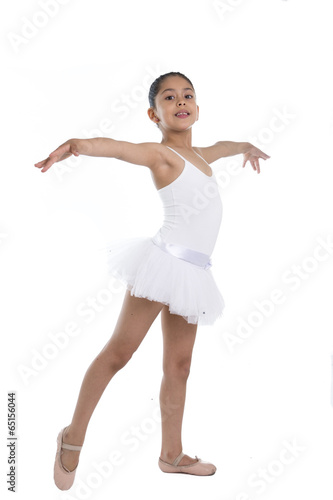 young cute little girl ballet dancer dancing on white background