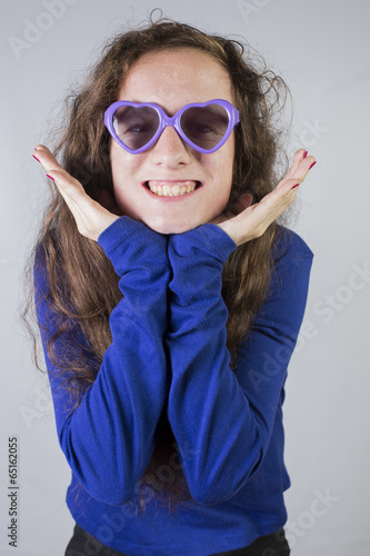 Teen with heart shaped sunglasses