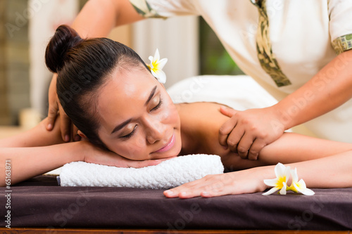Indonesian woman wellness massage in spa