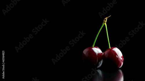 Fotografia Two ripe red cherries