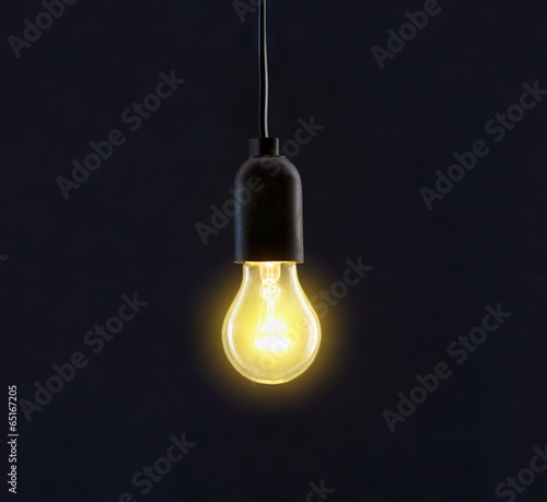 Light bulb lamp on black background