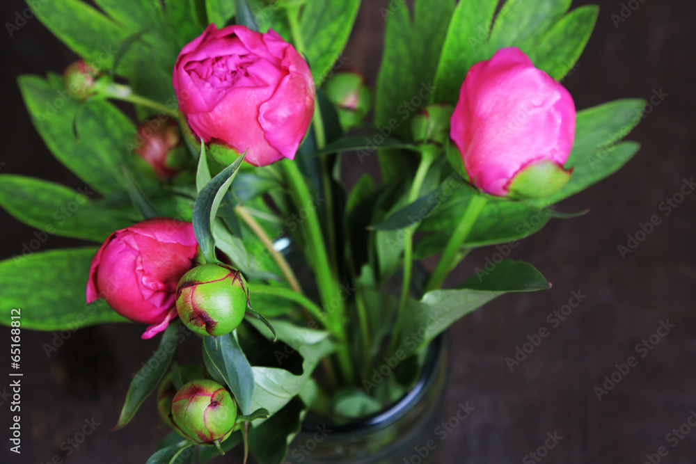 Beautiful peonies in vase on wooden background Beautiful peonies in vase on wooden background