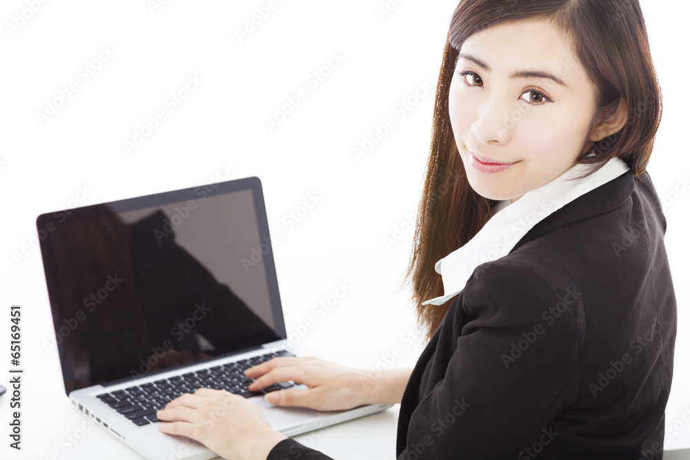 young businesswoman sitting and using a laptop young businesswoman sitting and using a laptop