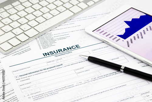 insurance questionnaire and tablet