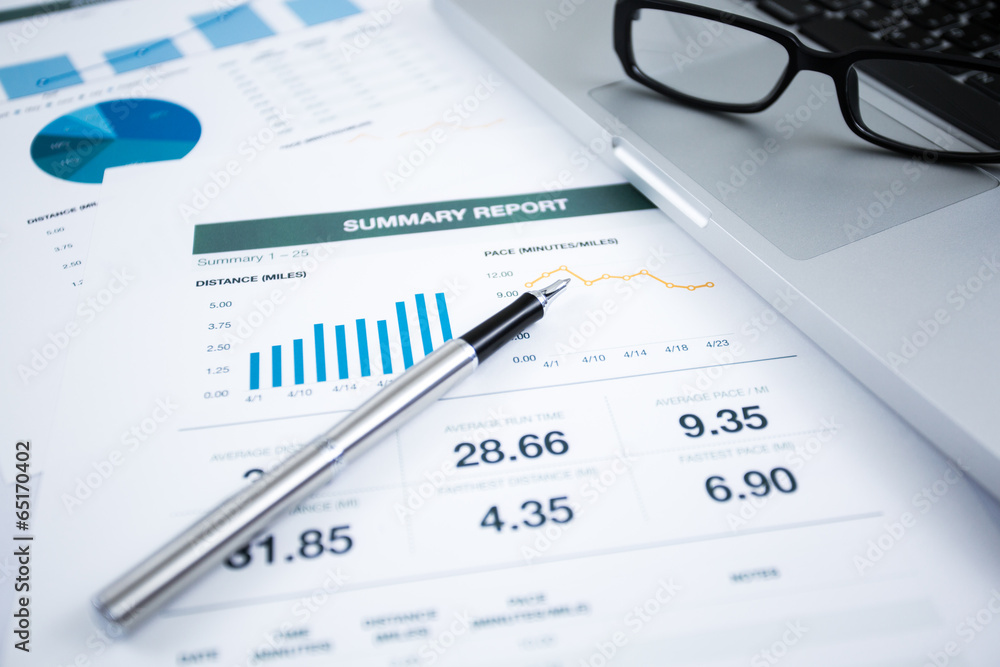Businessman analyzing investment charts with laptop Businessman analyzing investment charts with laptop