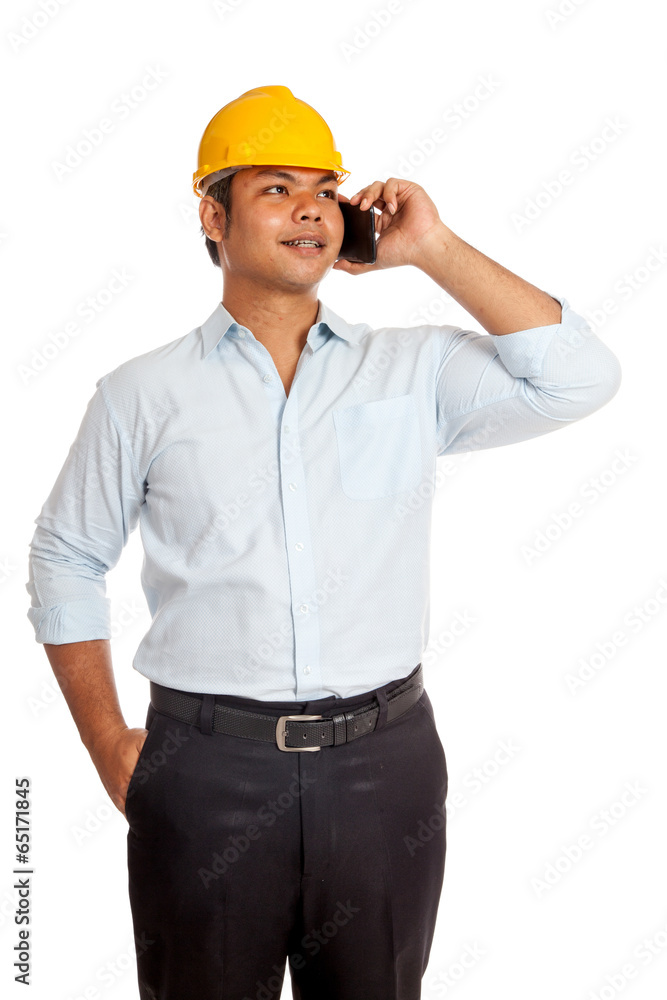 Asian engineer man talking on a phone smile and look up