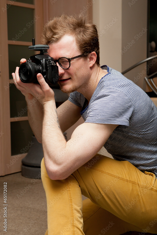 Photographer at work in photographic studio Photographer at work in photographic studio