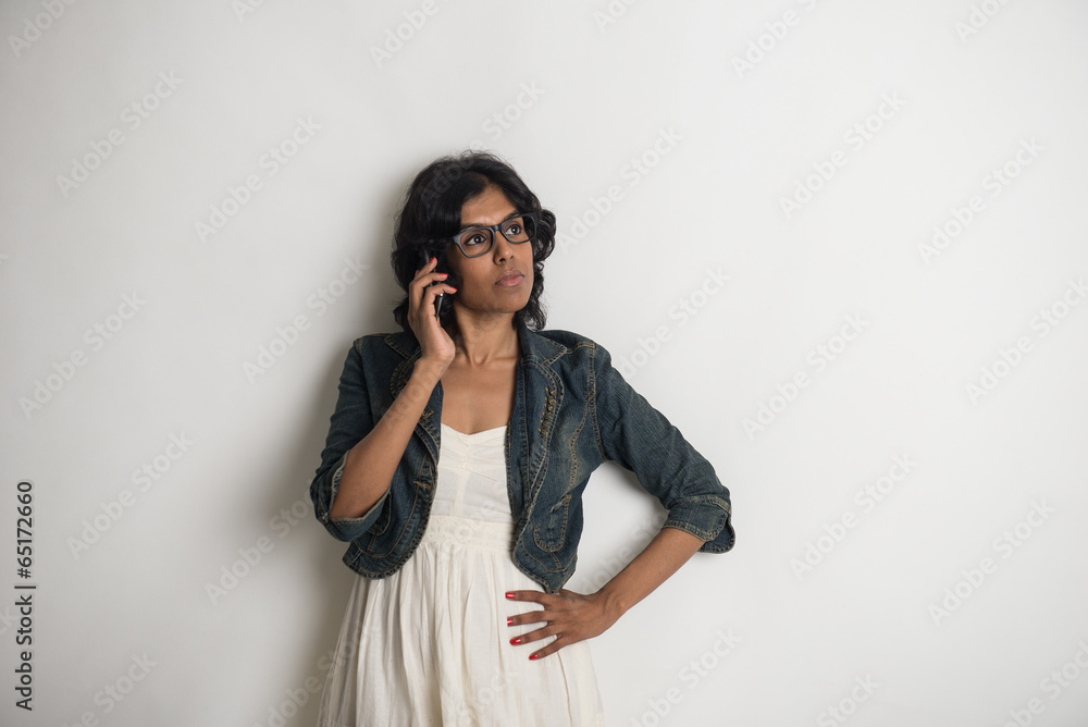 casual indian female with grey background casual indian female with grey background