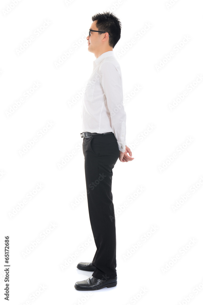 Young Asian business man full body side view isolated on white b Young Asian business man full body side view isolated on white b