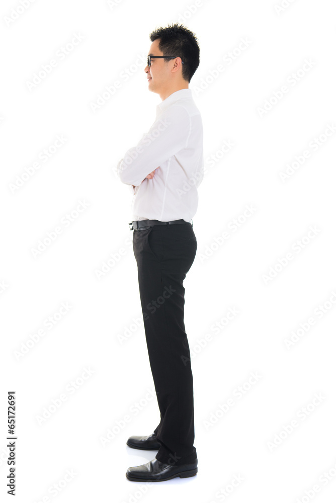 Young Asian business man full body side view isolated on white b Young Asian business man full body side view isolated on white b