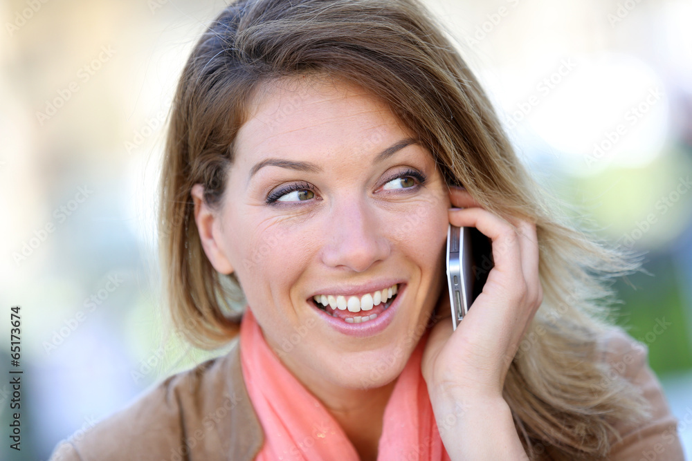 Portrait of blond woman using smartphone Portrait of blond woman using smartphone