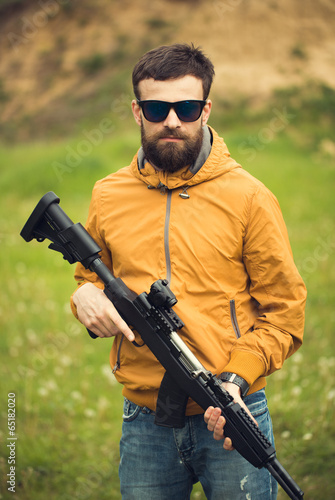 A man with an automatic rifle