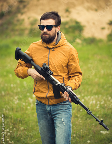 A man with an automatic rifle
