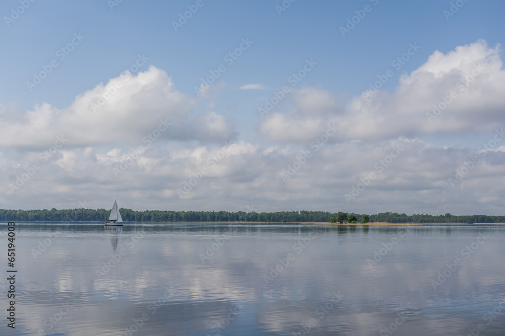 Sail boat on a calm lake