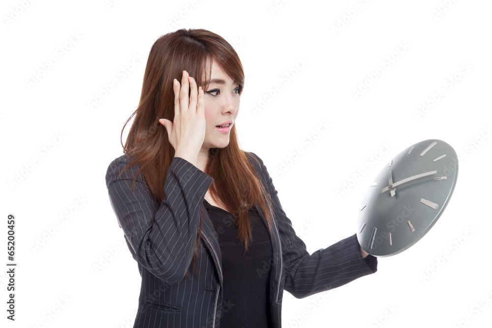 Asian Businesswoman surprise look at a clock Asian Businesswoman surprise look at a clock