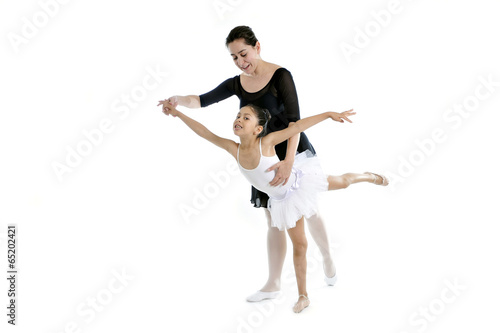 little girl ballerina learning dance lesson with ballet teacher