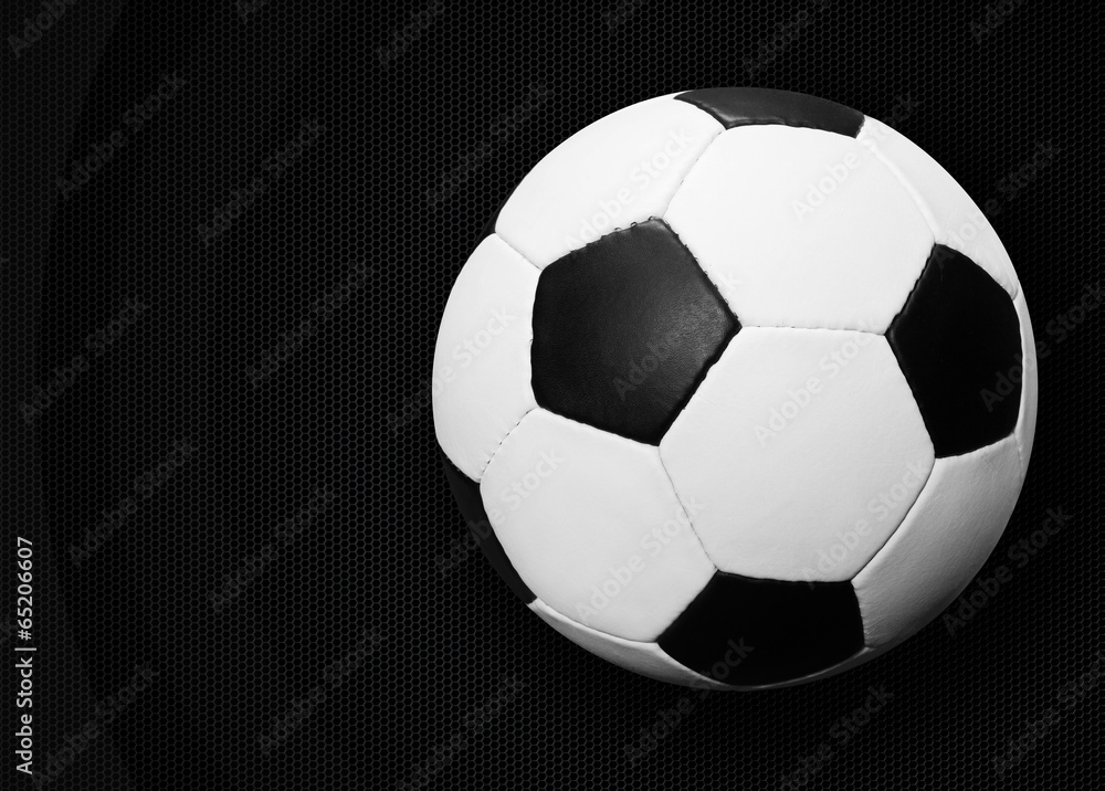 Naklejka premium Soccer ball on dark
