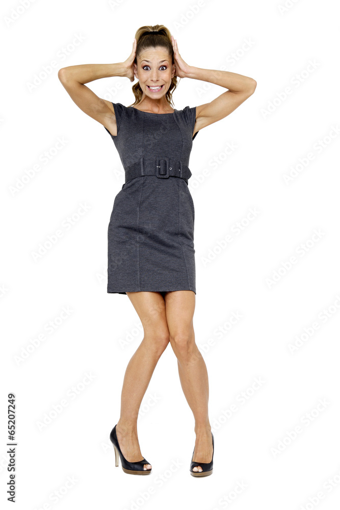 Junge Frau im Minikleid , die Hände auf den Kopf Junge Frau im Minikleid , die Hände auf den Kopf