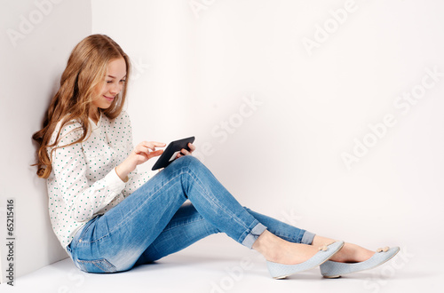 Young beauty student girl with tablet