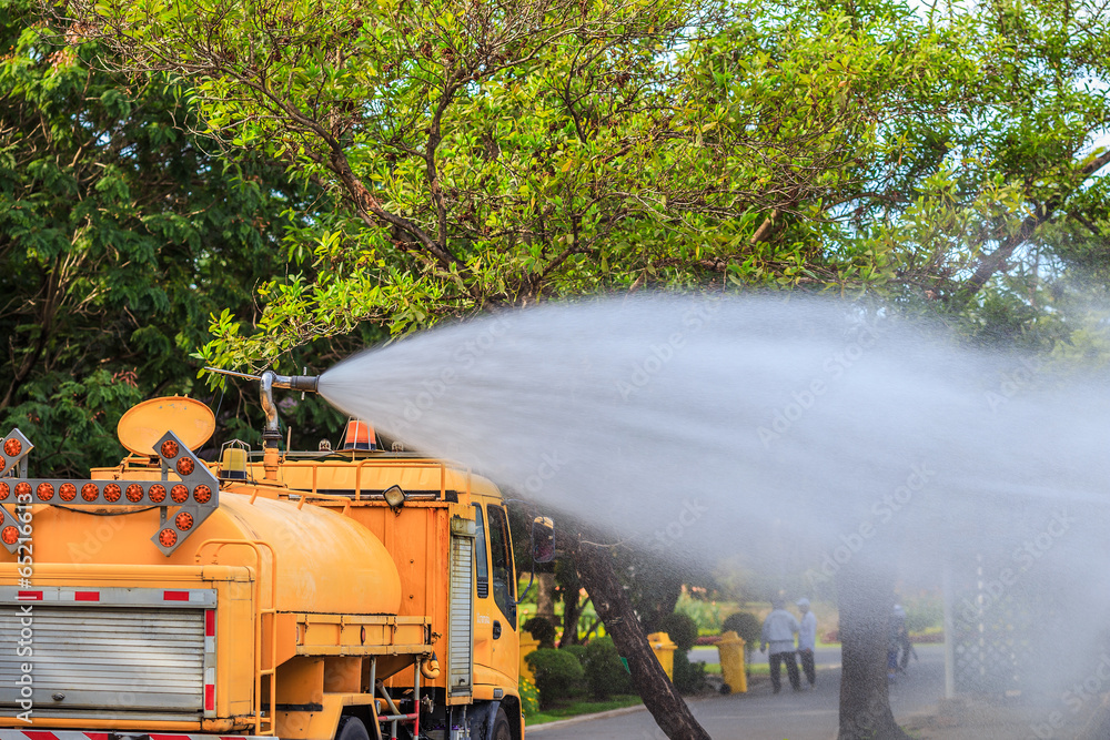 water the plants with 6 wheel truck water to flower in the park water the plants with 6 wheel truck water to flower in the park